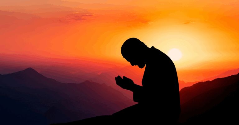 silhouette of man praying sunrise