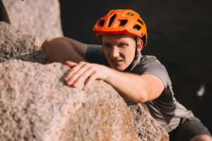determined rock climber, reaching the top