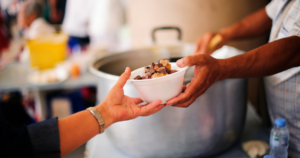 hand serving soup