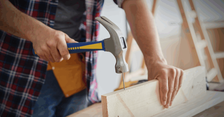 man using a hammer