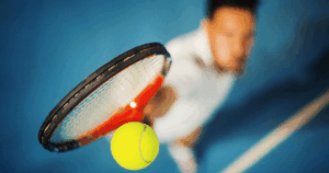 tennis racket making contact with ball