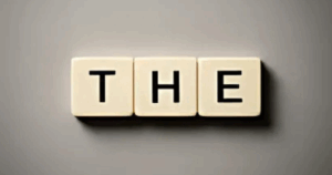 Scrabble tiles spelling 'THE'—symbolizing the key word in Step 12 of addiction recovery