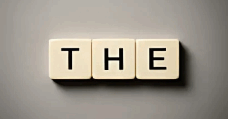 Scrabble tiles spelling 'THE'—symbolizing the key word in Step 12 of addiction recovery
