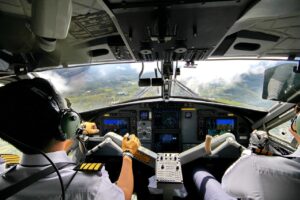 Pilot in airplane cockpit symbolizing spiritual guidance in addiction recovery